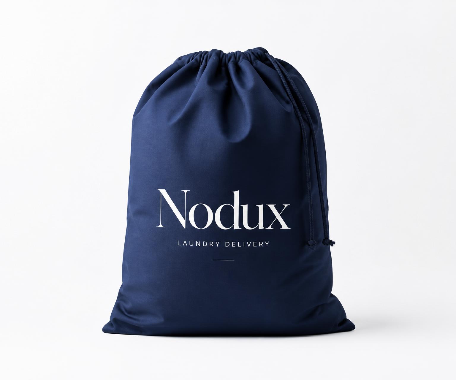 Folded garments in navy concierge box